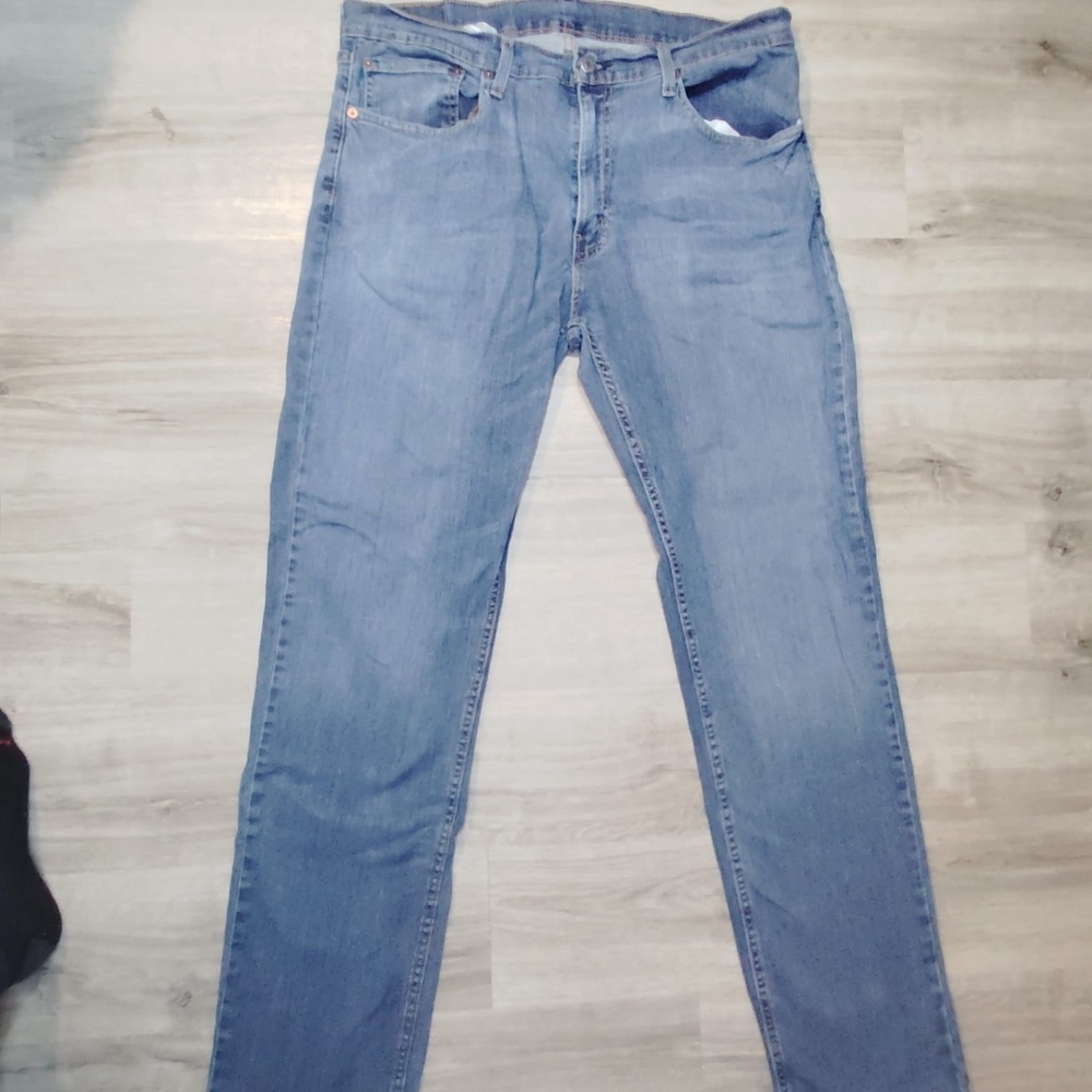 Levi's brand blue jeans, size 36, with a small detail B18-C1543